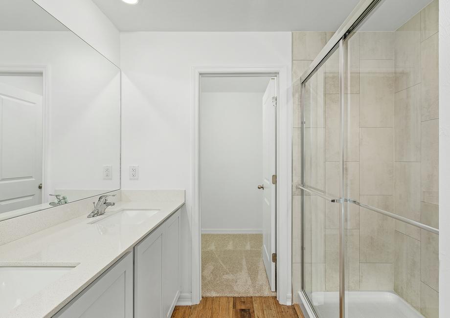 Get ready for the day in the master bathroom that comes equipped with a walk-in shower and double sink counter