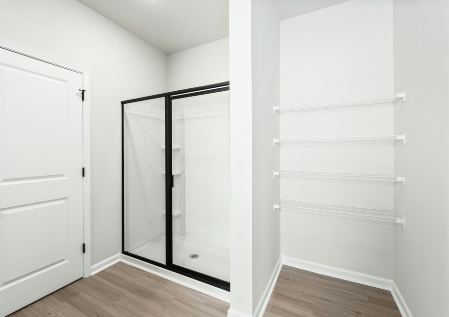 The master bathroom has a glass-enclosed shower