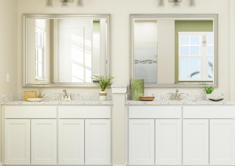 Rendering of spacious master bath showing
  a double sink vanity with white cabinetry and light fixtures and a view of
  the master bedroom on the right.