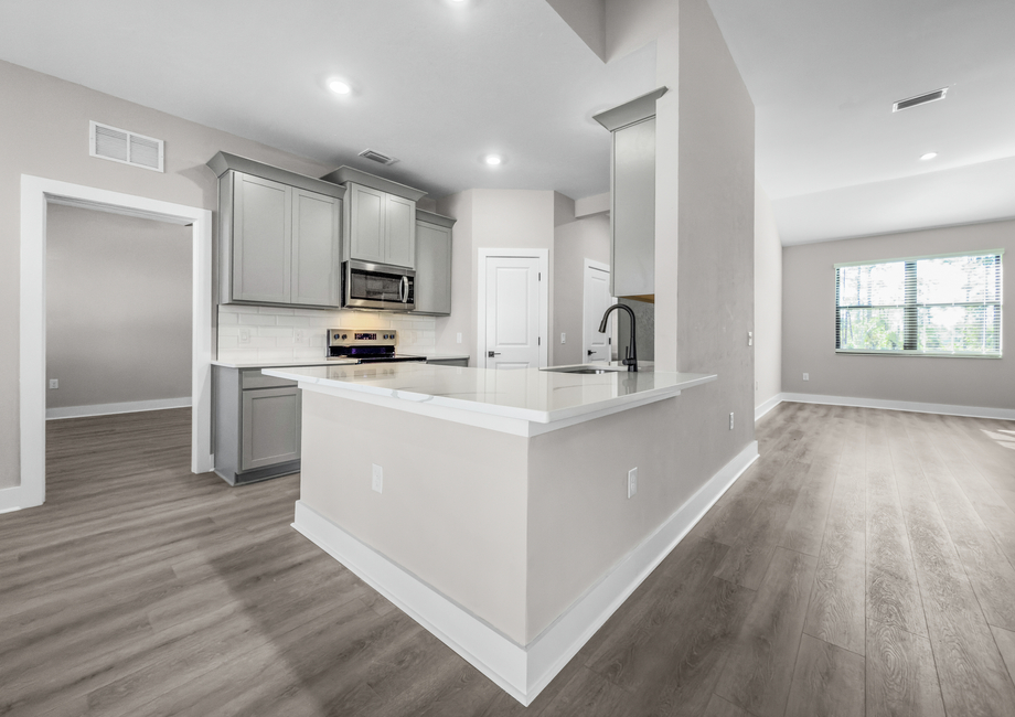 The kitchen includes upgraded, stainless-steel appliances