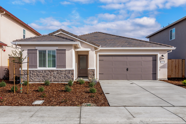 The Blazer is a beautiful home with stucco and stone.