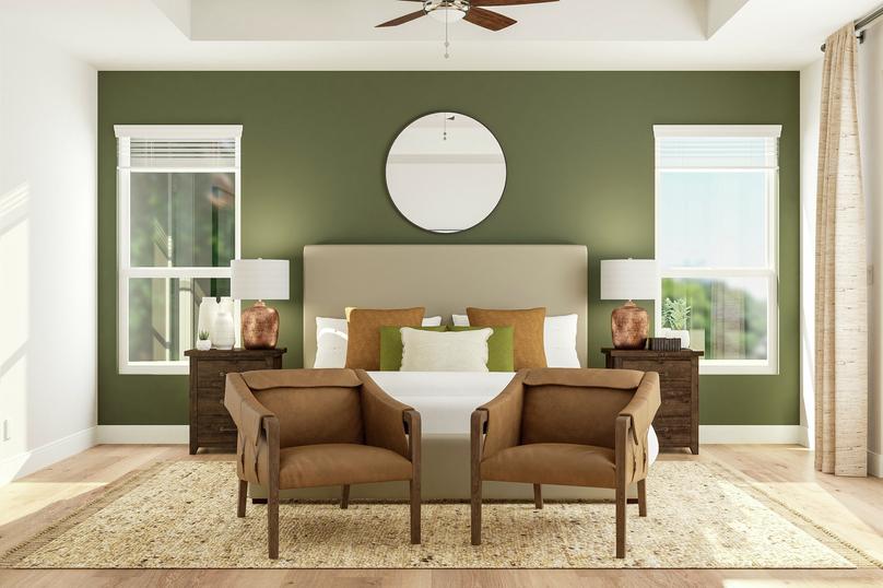 Rendering of the master bedroom focusing
  on two leather accent chairs sitting at the foot of a large bed. Two copper
  table lamps sit on nightstands in front of a green accent wall that features
  two large windows.