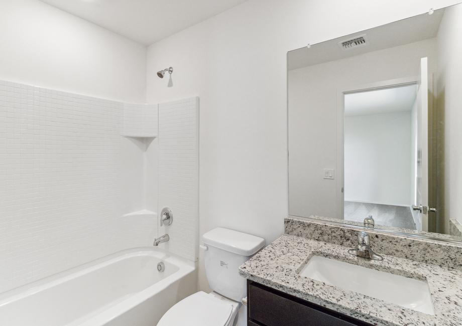 Master bathroom with a single-sink vanity and dual shower and tub.