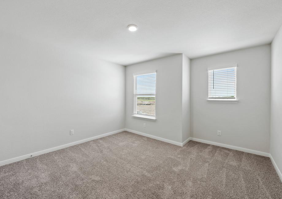 The secondary bedrooms of the Juniper plan are a perfect space for a child's bedroom or as a guest room.