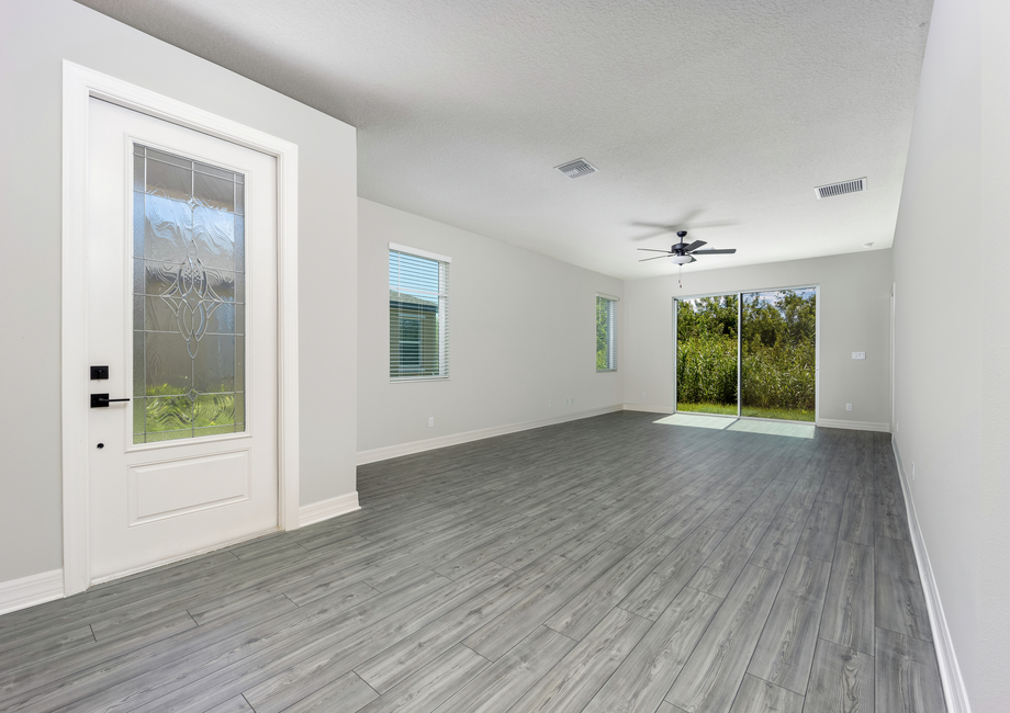 The family room has a sliding glass door that leads to the backyard