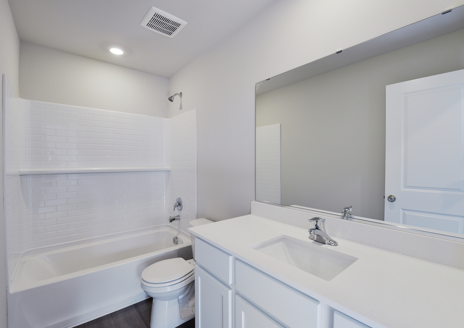 The secondary bathroom has a tub/shower combo.