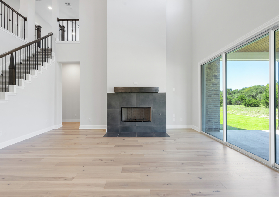 The spacious living room has plenty of space for large furniture.