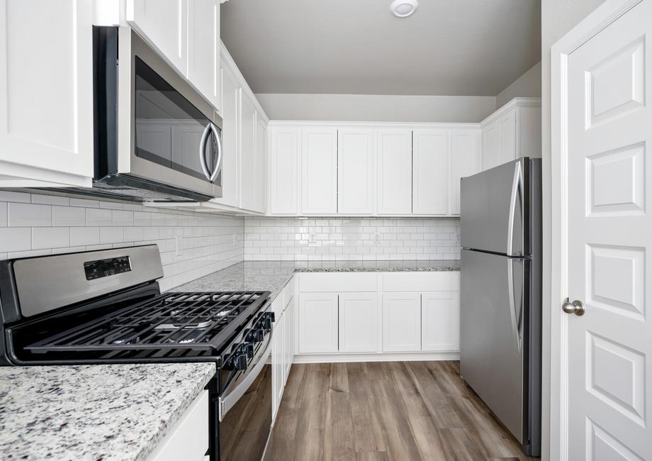 The kitchen has energy-efficient, stainless-steel appliances.
