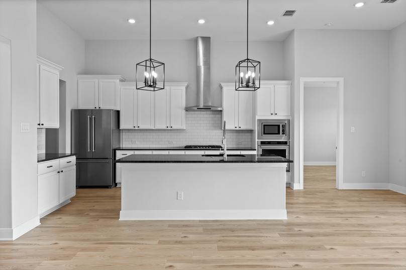 Sprawling kitchen island is located in the kitchen.