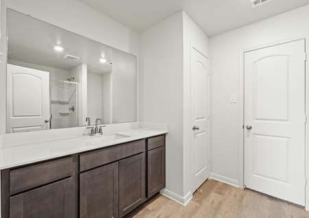 The master bathroom of the Rio Grande floor plan has a large vanity.