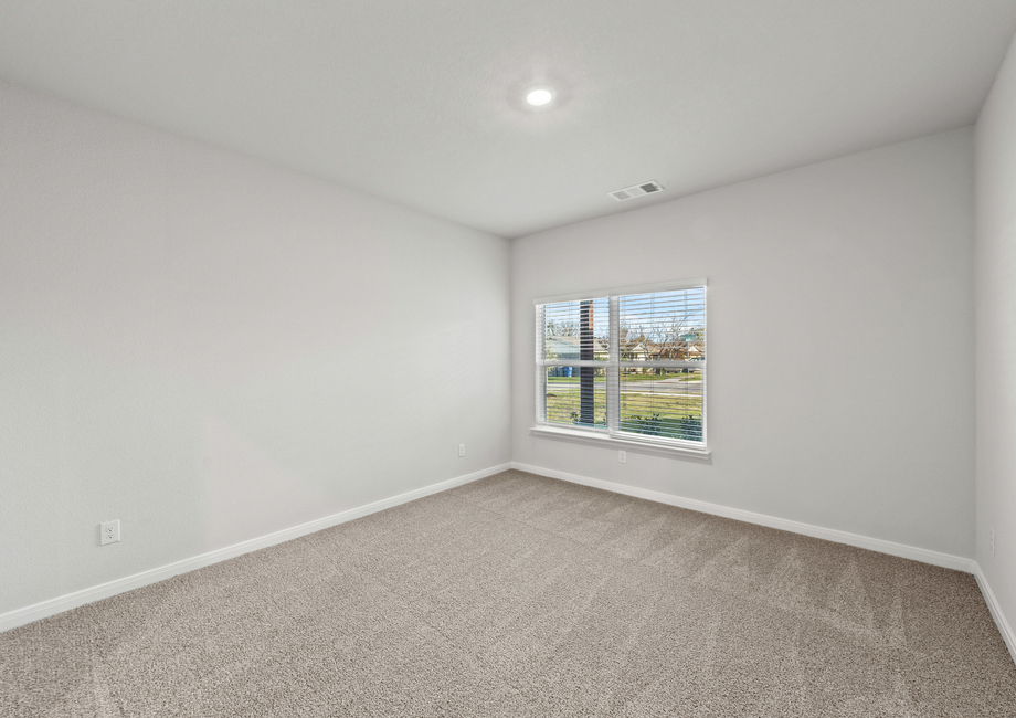 The master bedroom of the Piper has a large window that lets in great, natural light.
