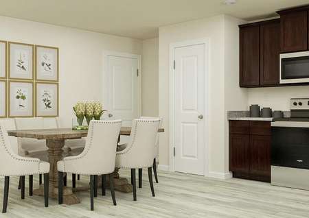 Rendering focused on the dining area,
  which has wood-look flooring, a six-person rectangular table and framed
  artwork.