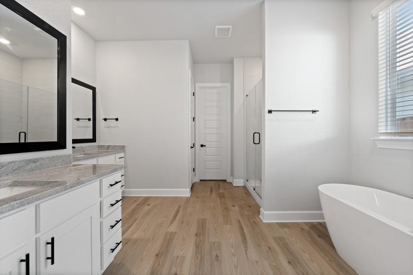 In the master bath you will love the standalone tub and the walk-in shower.