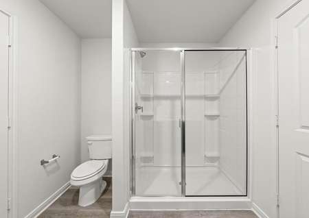 The master bathroom of the Rio Grande floor plan has a large glass, walk-in shower.