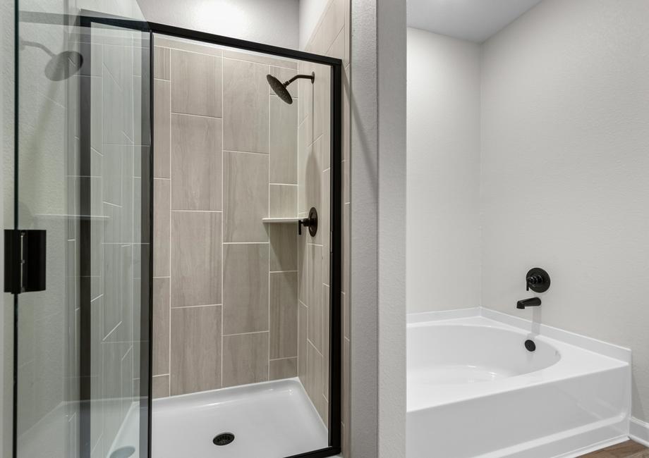 The master bath has a large soaker tub and a separate shower.