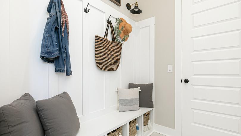 Mudroom with a wooden bench.