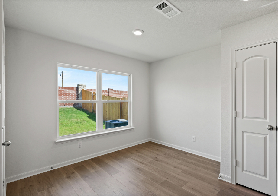 The dining room has a large window that lets in great, natural light and backyard views.