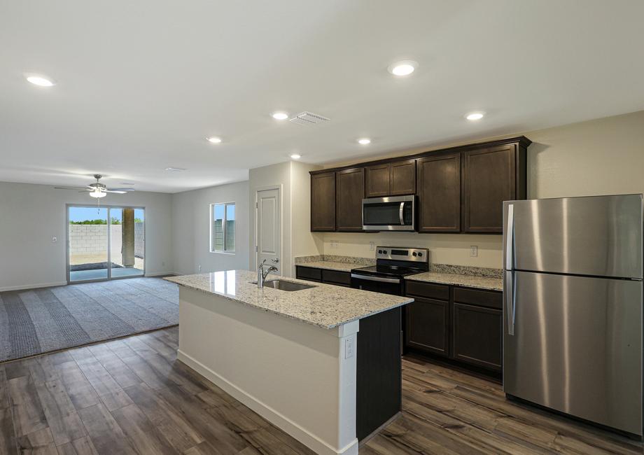 The kitchen overlooks the spacious living area.