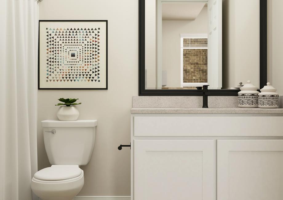 Rendering of a
  full bath in the Orchid floor plan. The room has a white cabinet vanity,
  black-framed mirror, toilet and tiled shower.