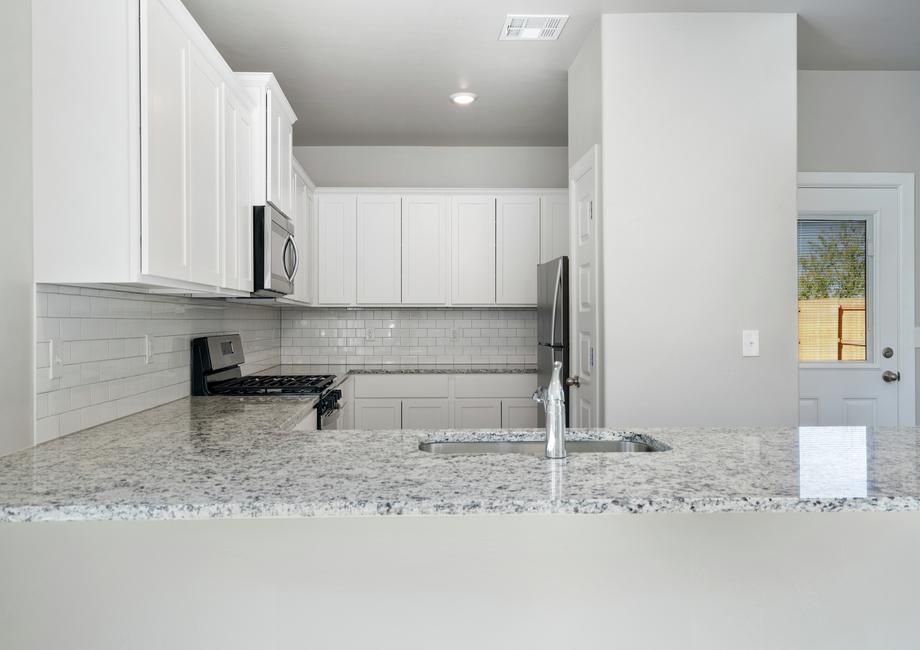 The kitchen of the Sudan has beautiful tile backsplash.