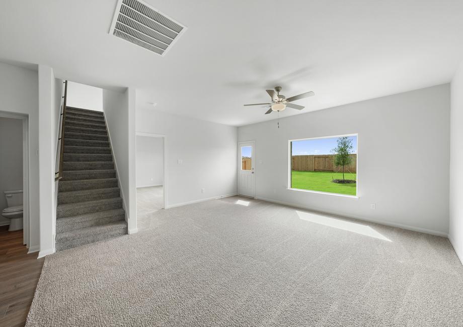 The open layout connects the kitchen with the dining room and family room.