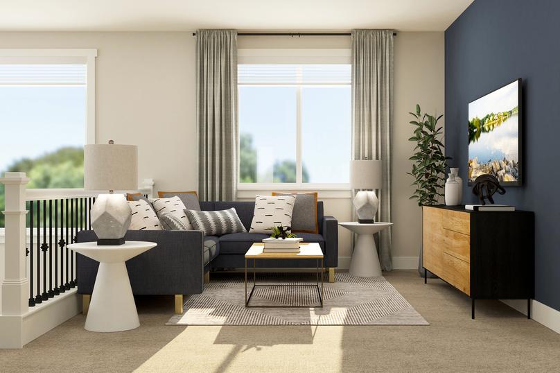 Rendering of loft furnished with a blue
  sectional and a coffee table. This room also has a two large windows.Â 