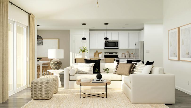Rendering of a living room furnished with
  a white sectional couch and two poufs.