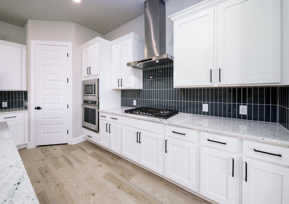 The kitchen comes with stainless steel KitchenAid appliances.