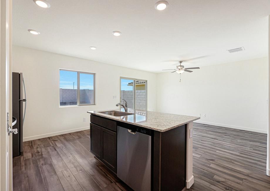 The kitchen overlooks the spacious living area.