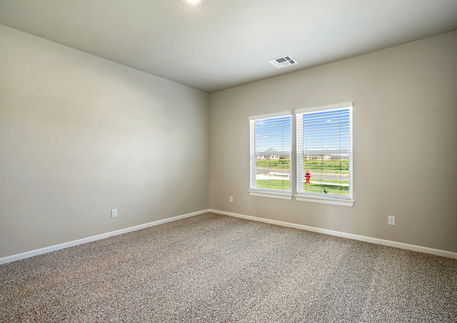 The master bedroom is filled with natural lighting creating the perfect space for relaxation.