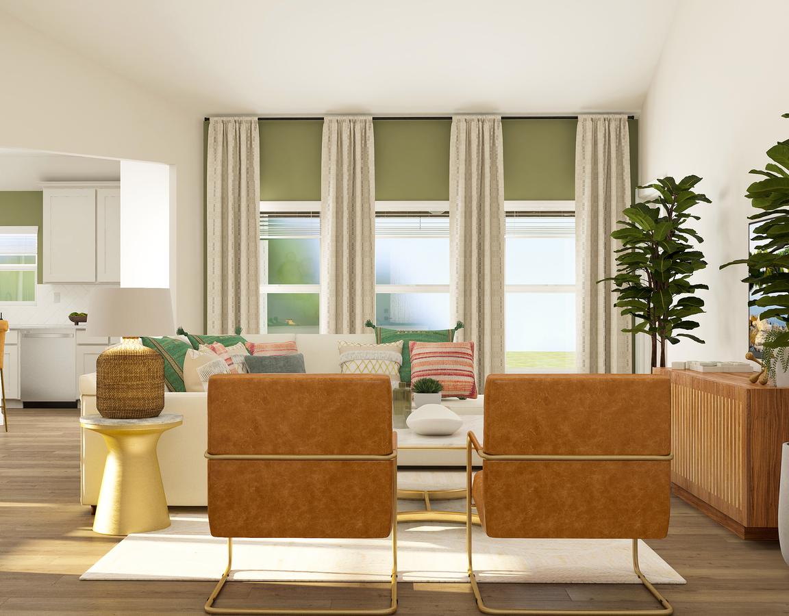 Rendering of the open and spacious living
  room in the Hendrie. Three windows overlook the back yard and fill the space
  with natural light. The room is furnished with a couch, accent chairs and an
  entertainment center.