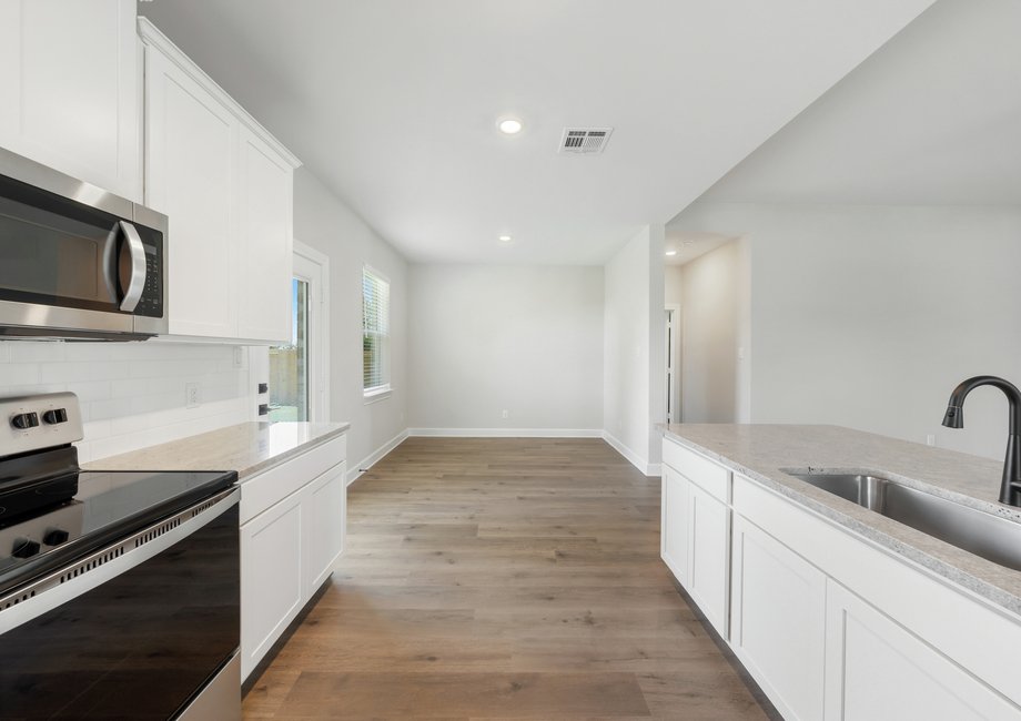 The dining room of the Reed floor plan sits right off of the kitchen.