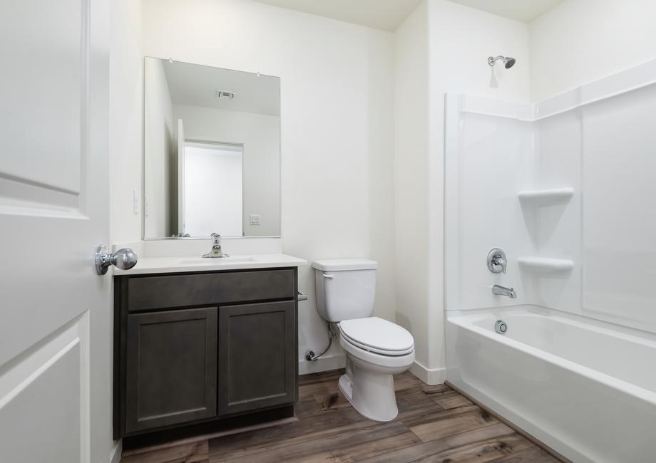 This bathroom has bright lighting, perfect for getting ready in the mornings.