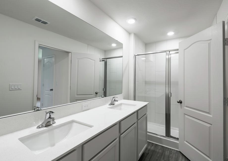 The master bathroom has a beautifully tiled shower