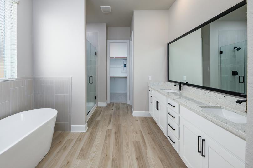 The master bath has it all, including a walk-in shower and a standalone tub.