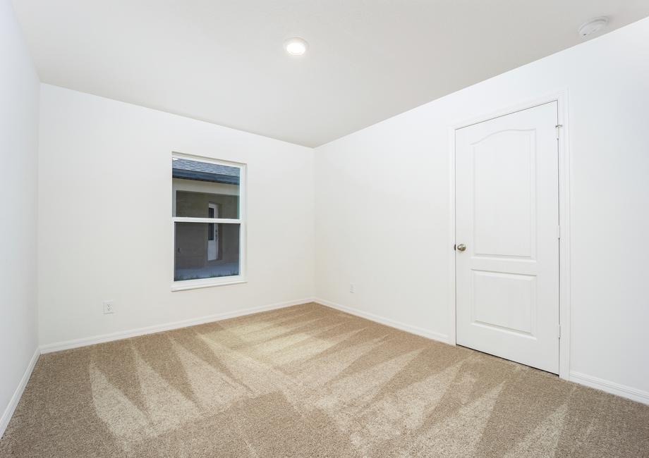 The second bedroom has lush carpet and its own closet