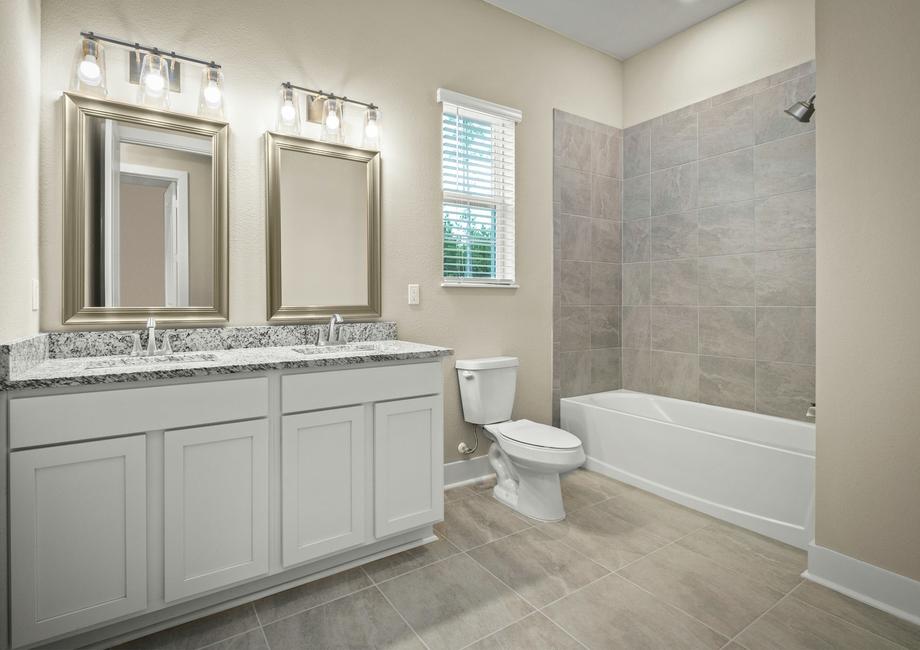 Secondary bathroom with vanity.