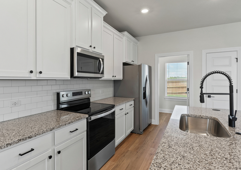 Stainless steel appliances are included.