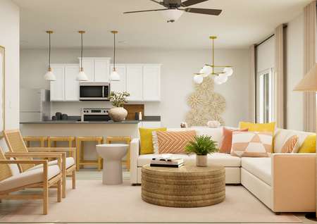 Rendering of a
  living room with a white sectional and two side chairs. The kitchen can be
  seen from behind the couch. 