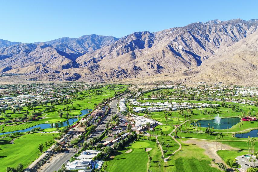 A beautiful aerial of Palm Springs and Palm Desert taking during a gorgeous blue-sky morning.