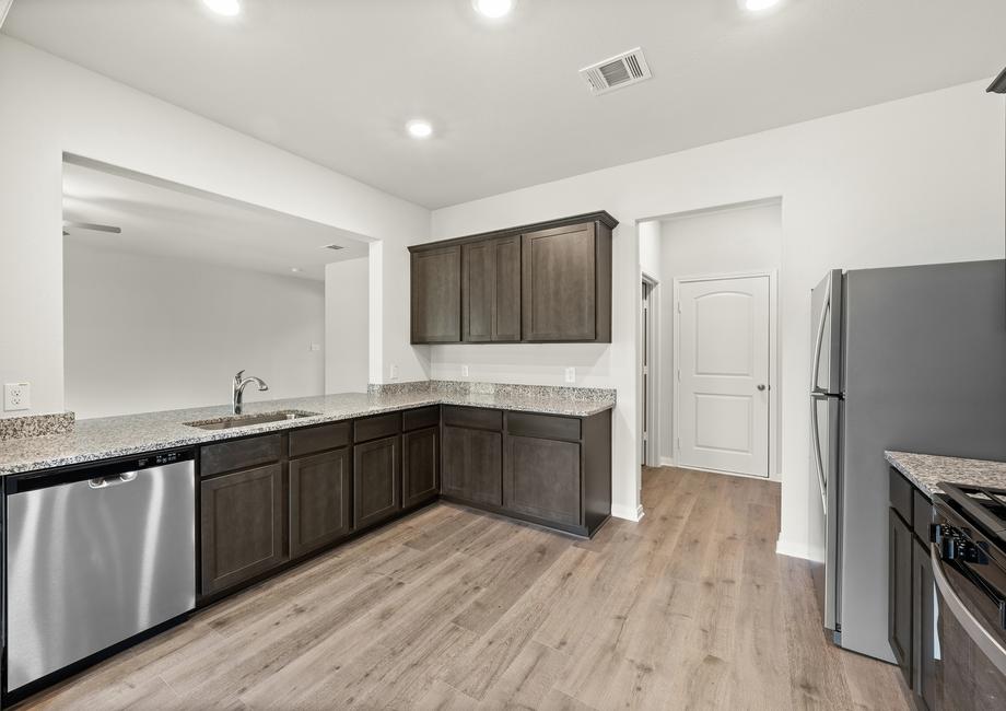 The kitchen of the Rayburn has sprawling granite countertops.