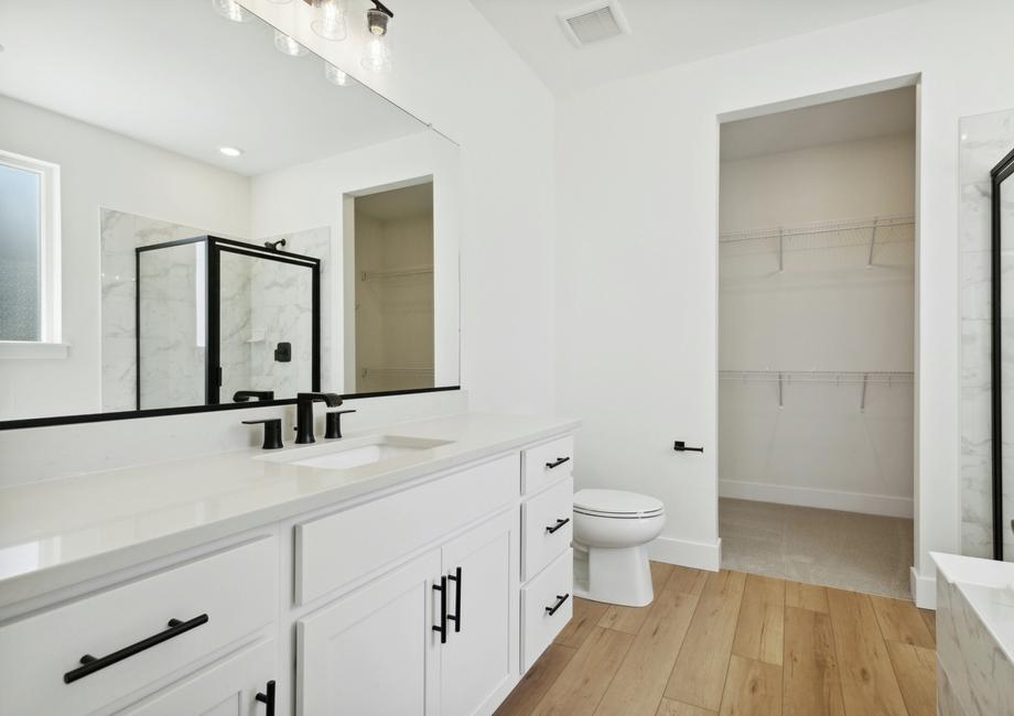 The master bathroom has a large vanity space.