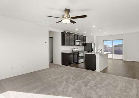 The open-concept layout in the Brazos floor plan allows easy access between the dining room, kitchen, and family room!