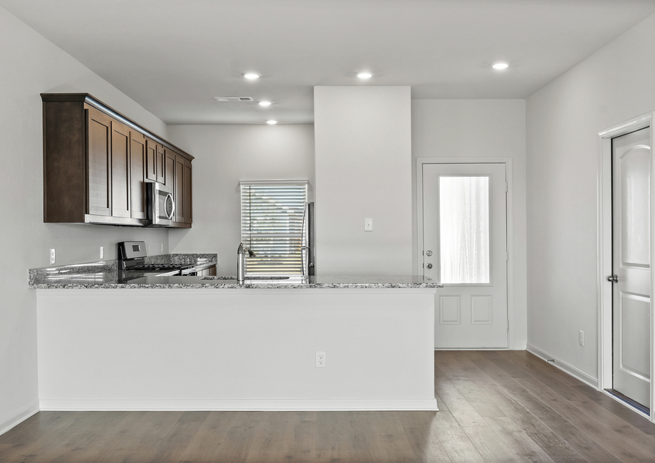 The kitchen has a wonderful breakfast bar.