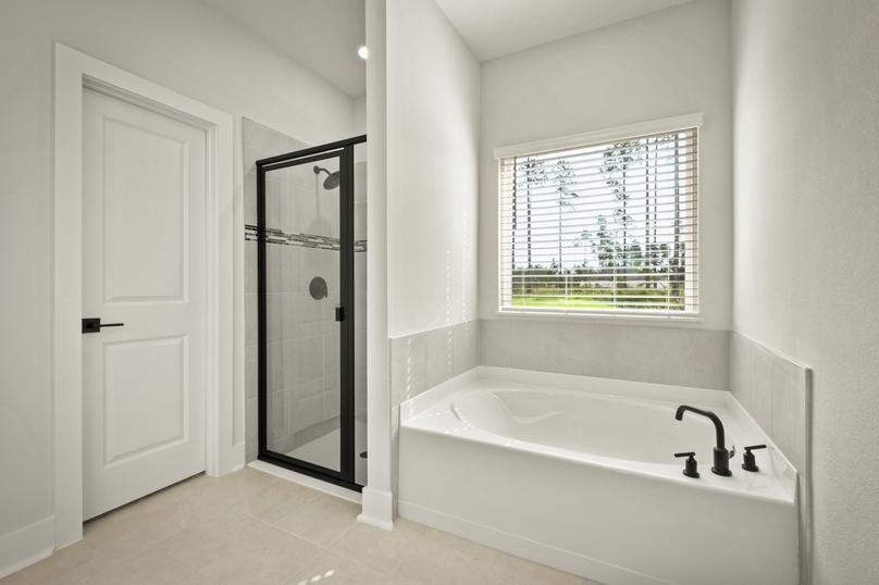 A large soaker tub and walk-in shower are included in the master bath.