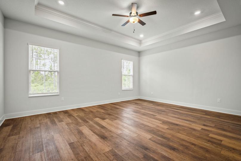 The master bedroom has gorgeous wood floors.