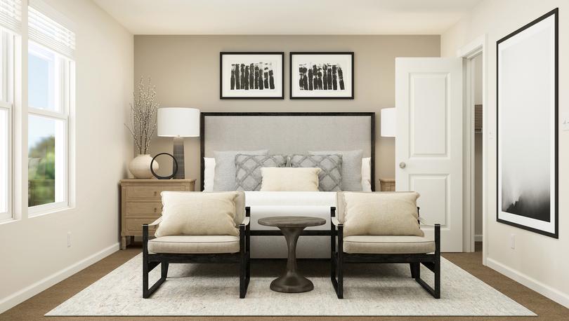 The master bedroom with side tables and a bed.