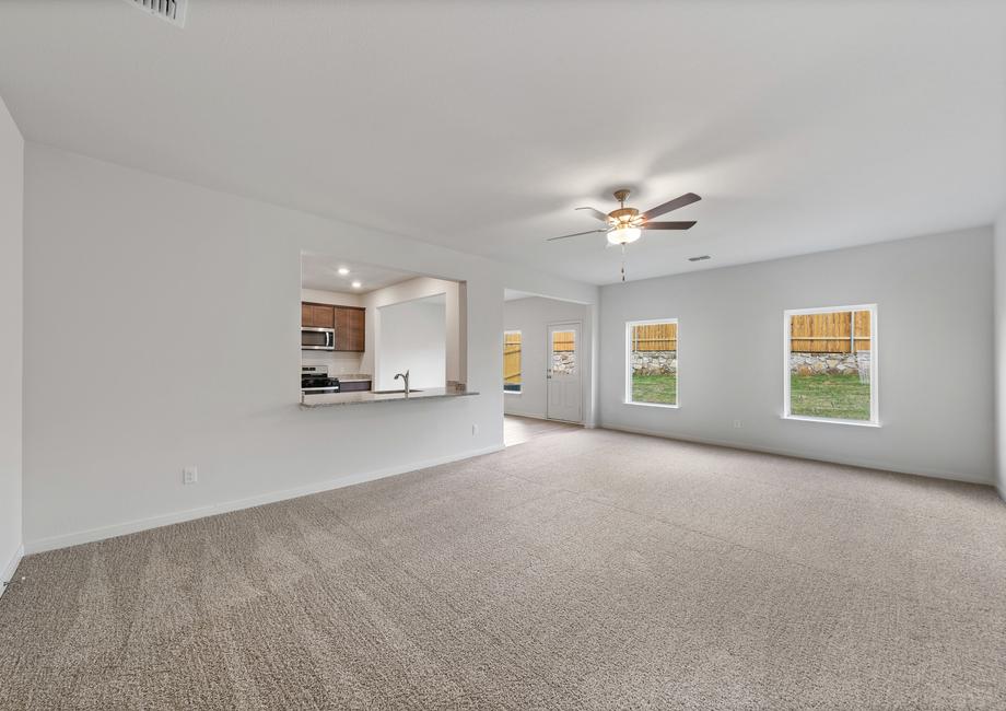 The open layout connects the family room with the kitchen and dining room.