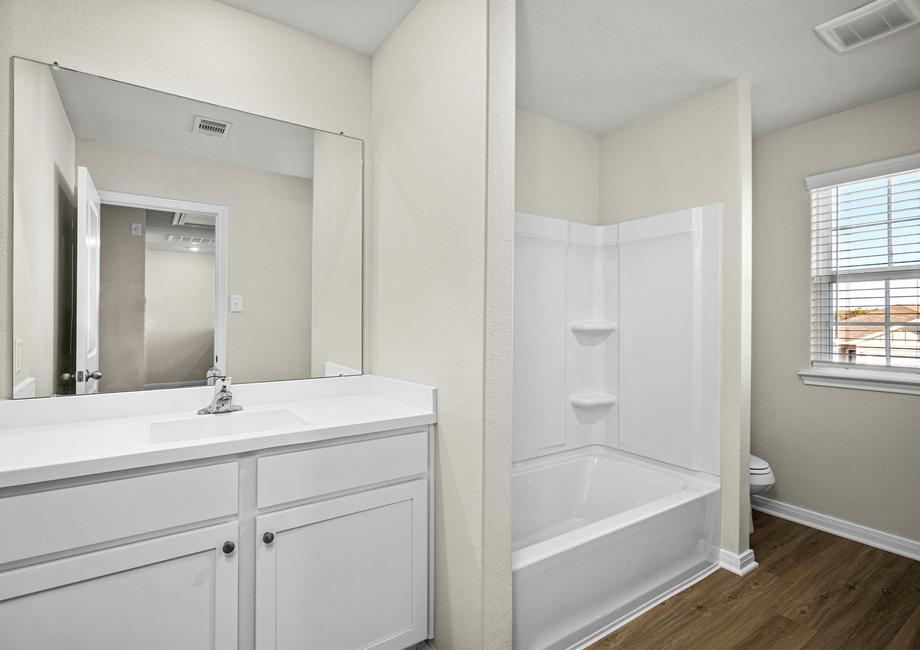 The secondary bathroom with a tub/shower combination.