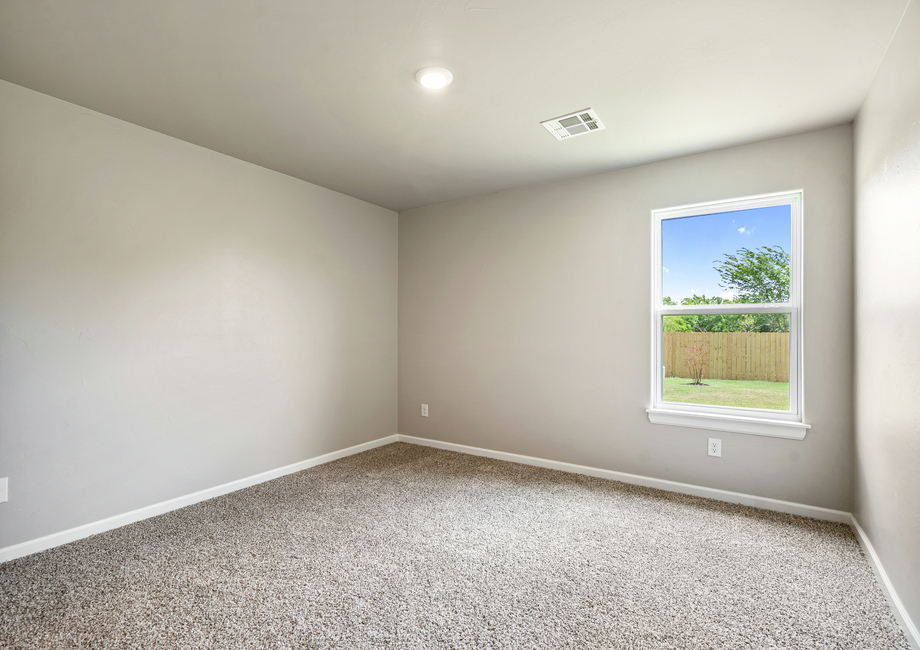 The master bedroom is filled with natural lighting. 
